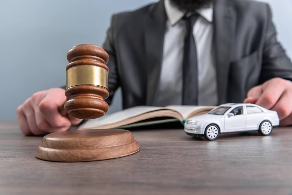 An attorney consulting with a client about a vehicle injury claim